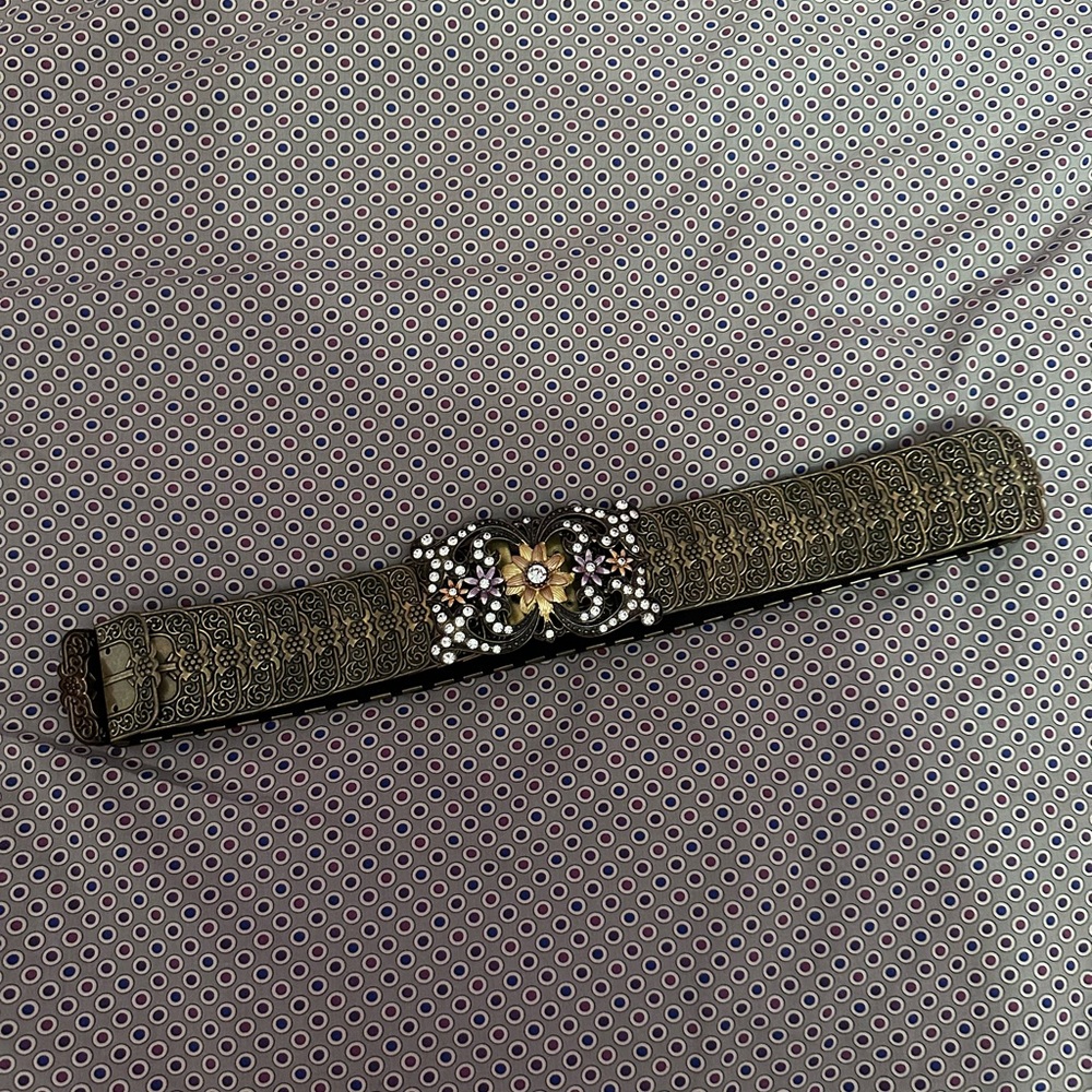 Gold belt with brooch